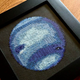 Illustration for article titled Cross-Stitched Planets Are the Perfect Handmade Gift For Space Nerds